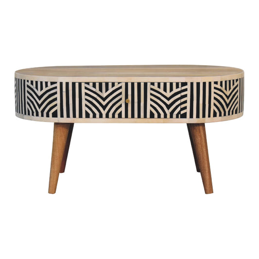 Oval bone inlay coffee table with black and white geometric pattern and tapered wooden legs