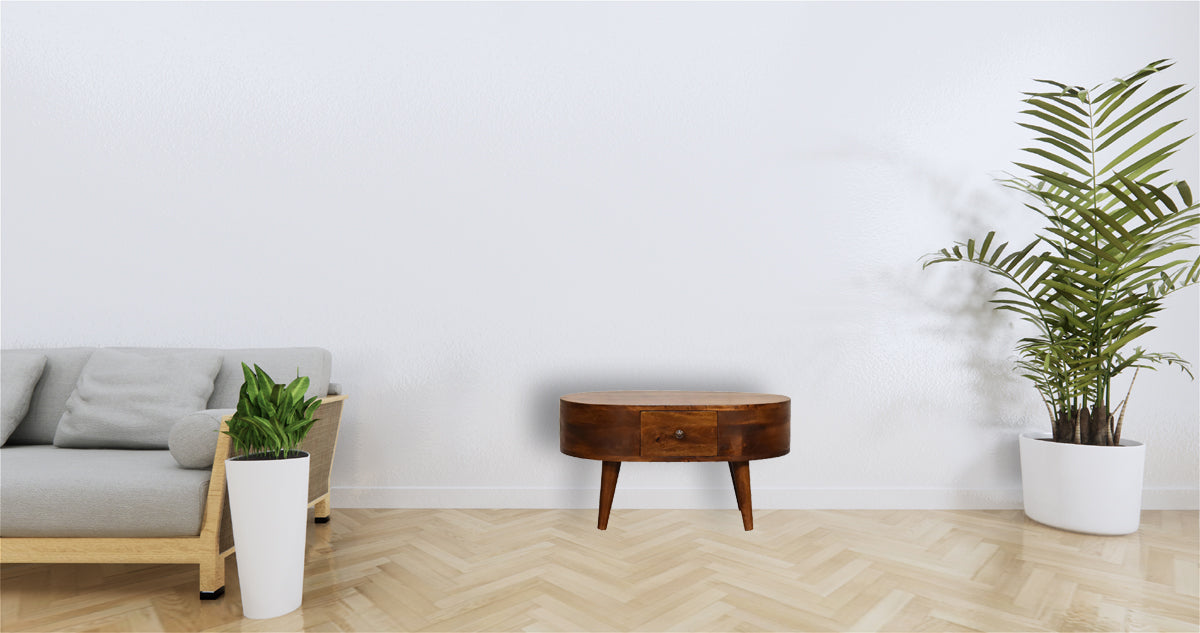 Round wooden accent table with single drawer and tapered legs midcentury modern style
