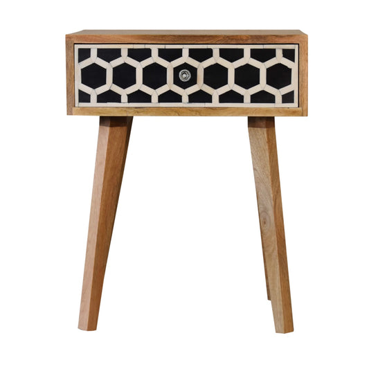 Wooden bedside table with black and white geometric inlay drawer front