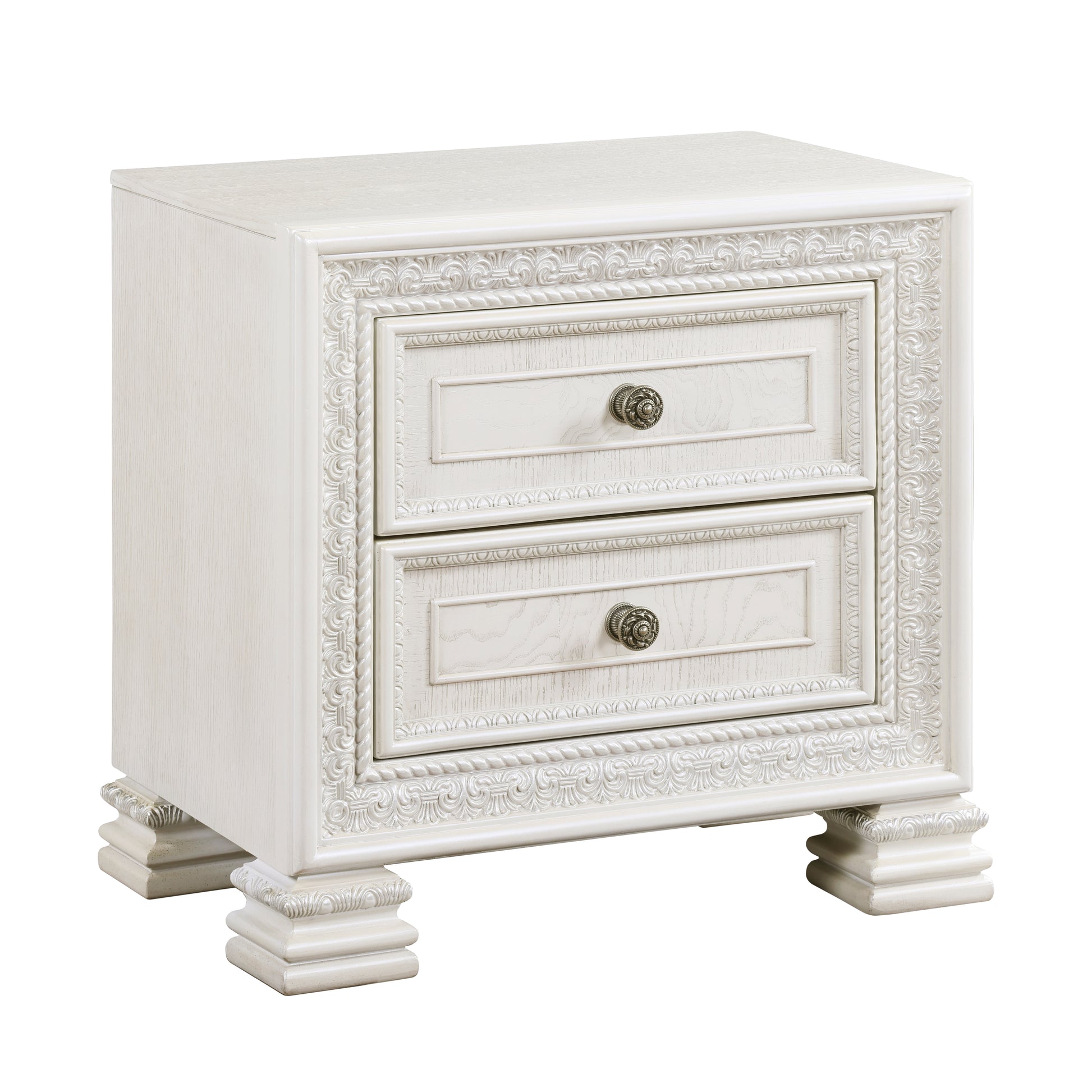 Antique white ornate nightstand with two drawers and decorative metal knobs