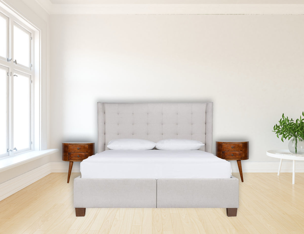 Tufted upholstered queen bed frame in light gray fabric with winged headboard