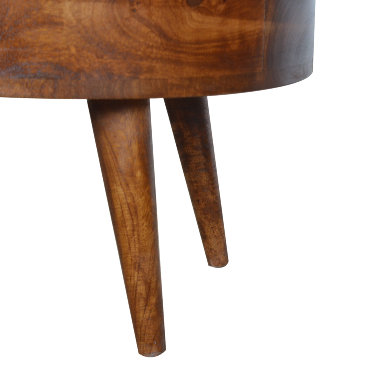 Closeup of tapered wooden legs on a midcentury modern side table