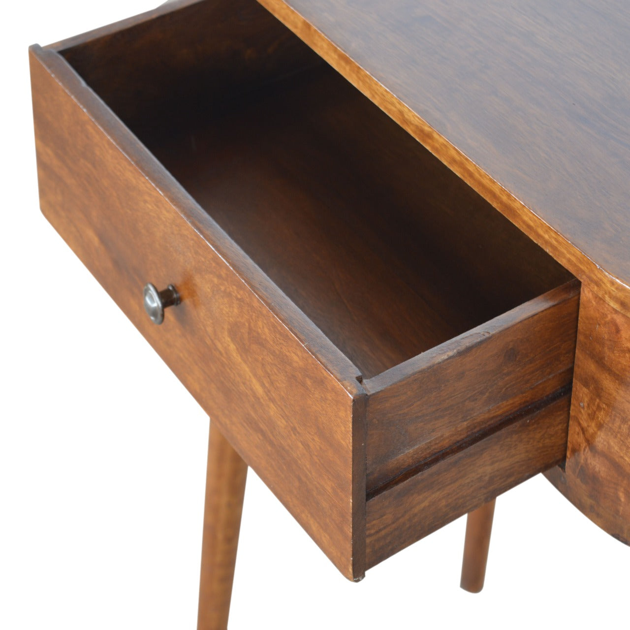 A midcentury modern bedside table with a warm walnut finish and an open drawer