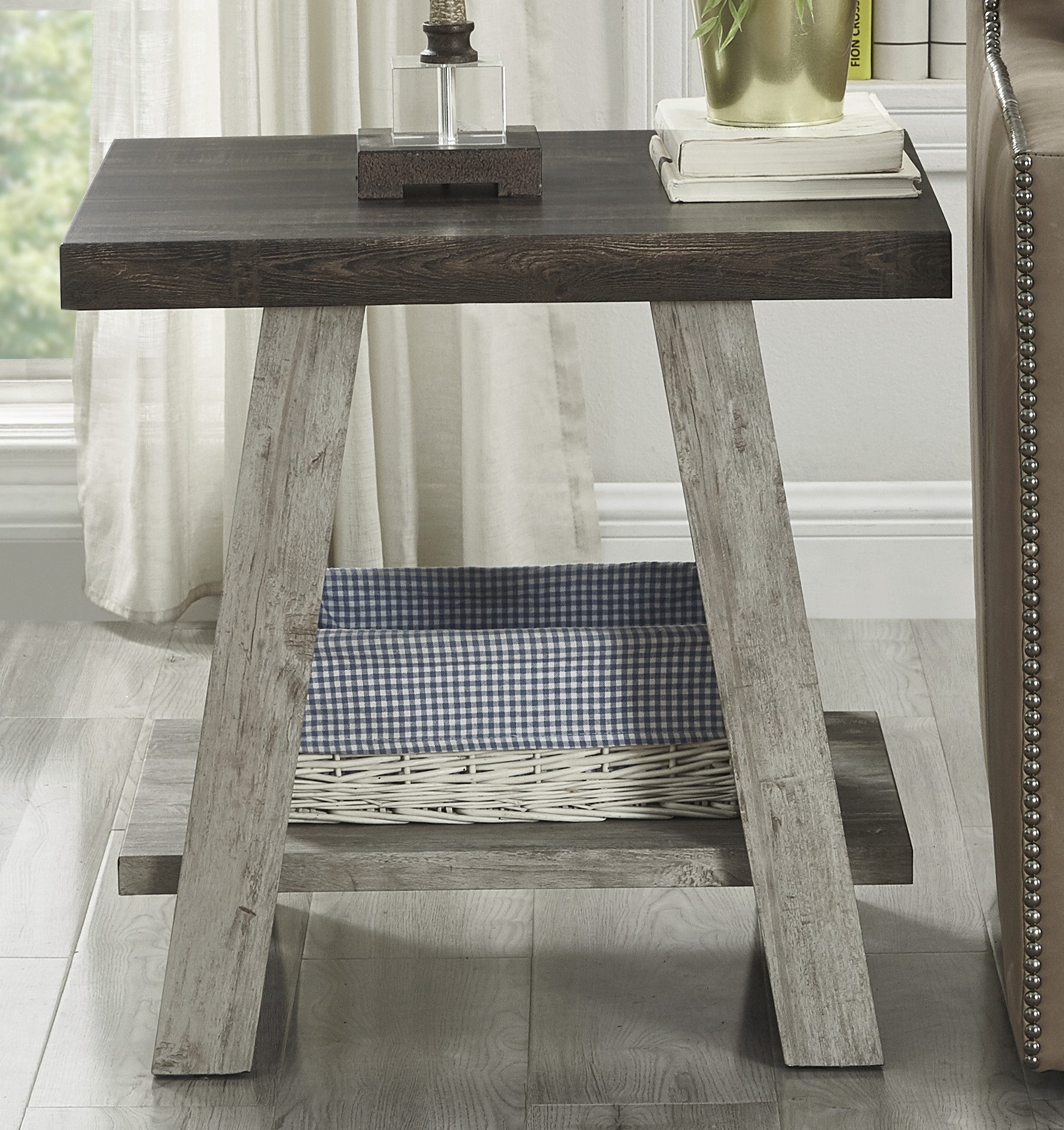 Rustic dark wood side table with a woven basket and checkered liner