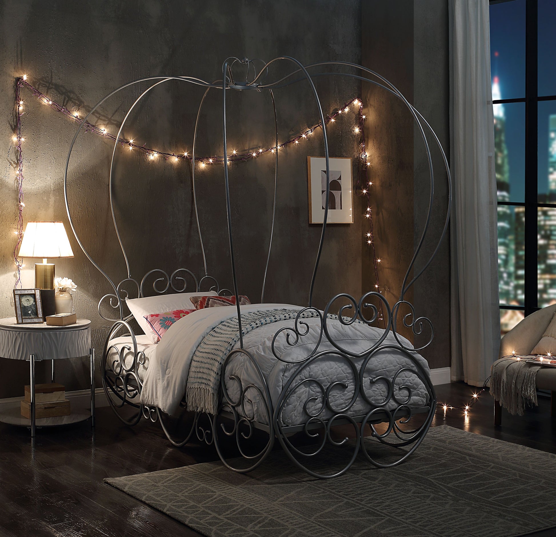 Grey metal Cinderella carriage bed frame with scrolled details creating a magical fantasy bedroom for kids