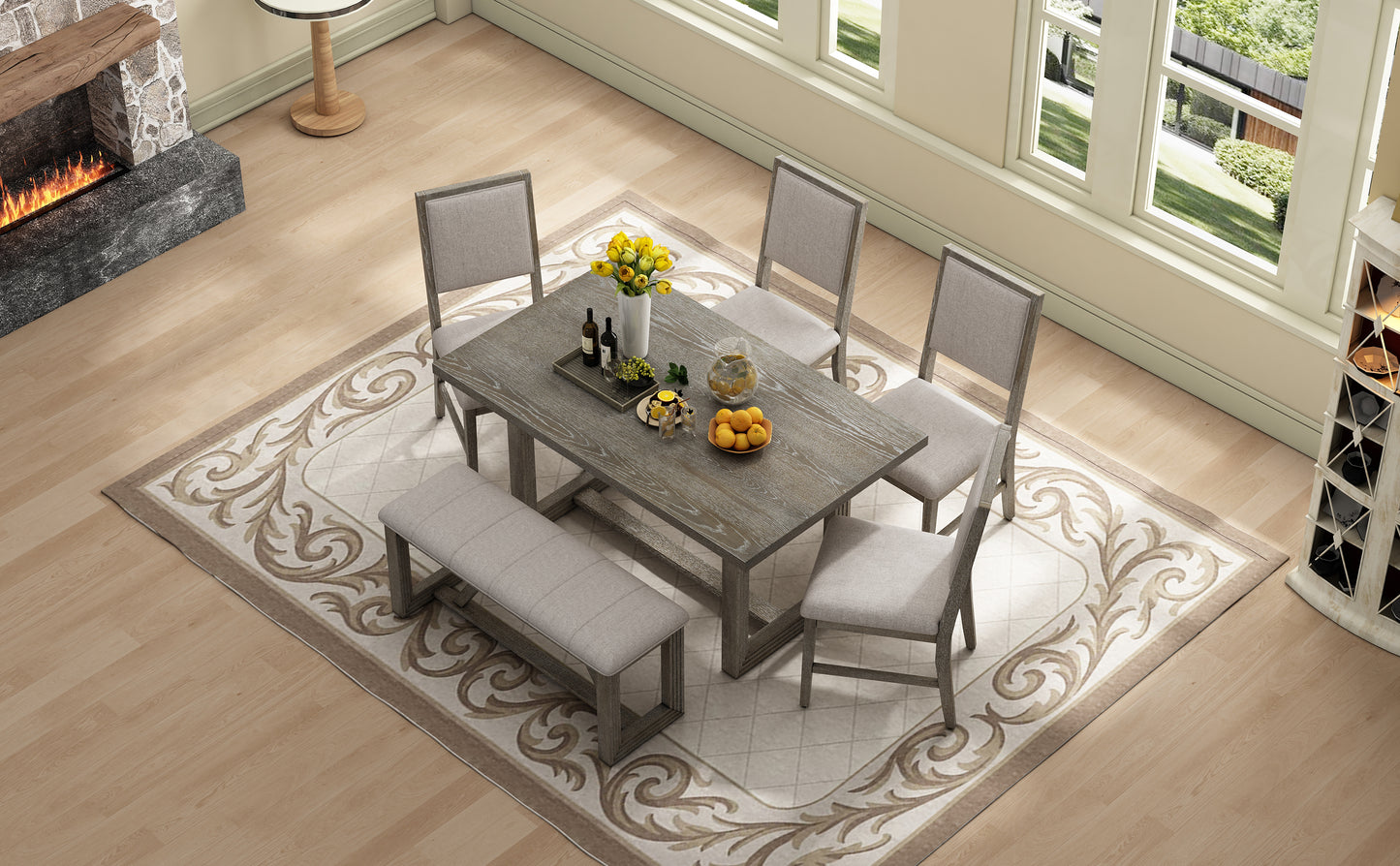Rustic gray wood dining table set with upholstered chairs and bench