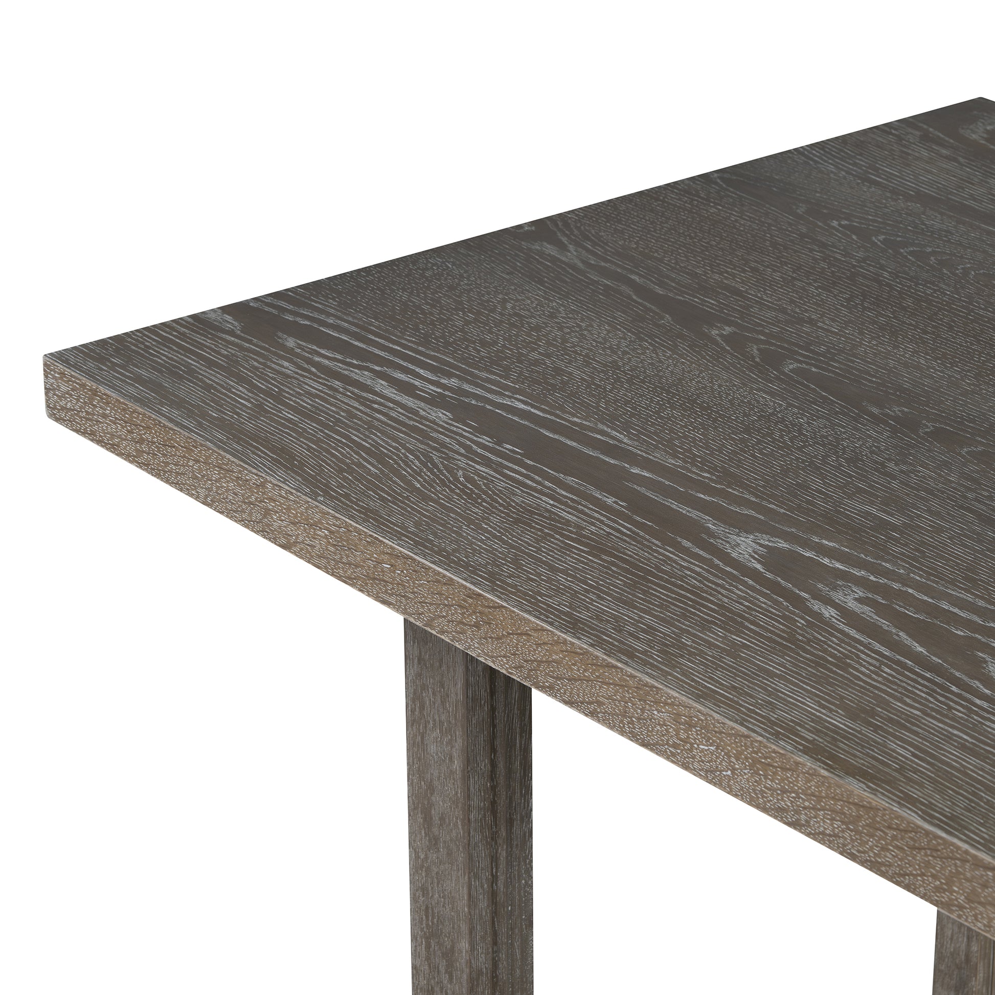 Closeup of a rustic gray wooden dining table with visible grain