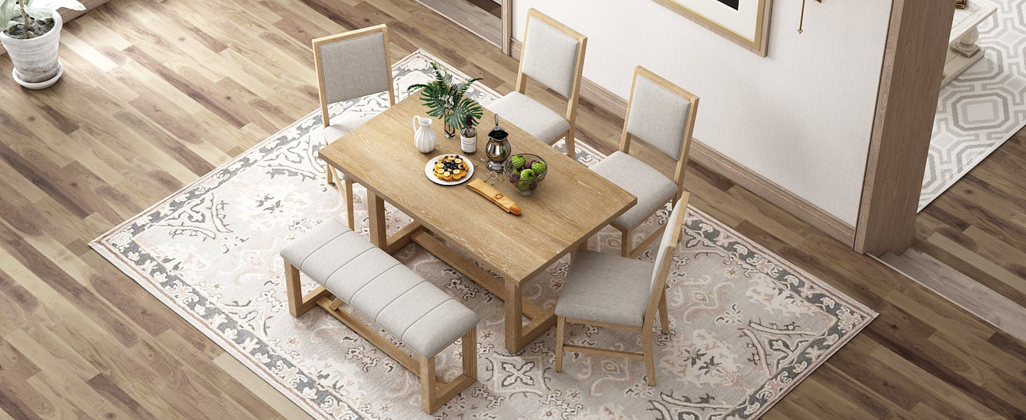 Rustic oak dining table with upholstered bench and chairs