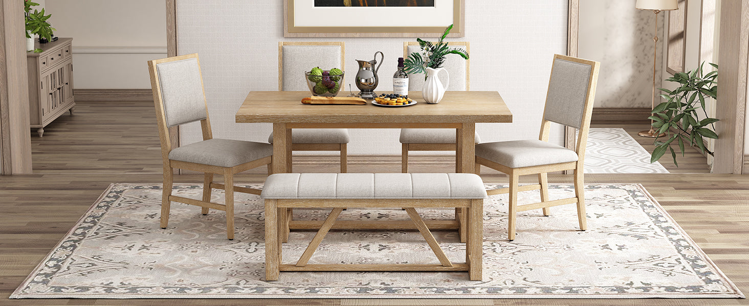 Natural oak dining table with upholstered chairs and bench