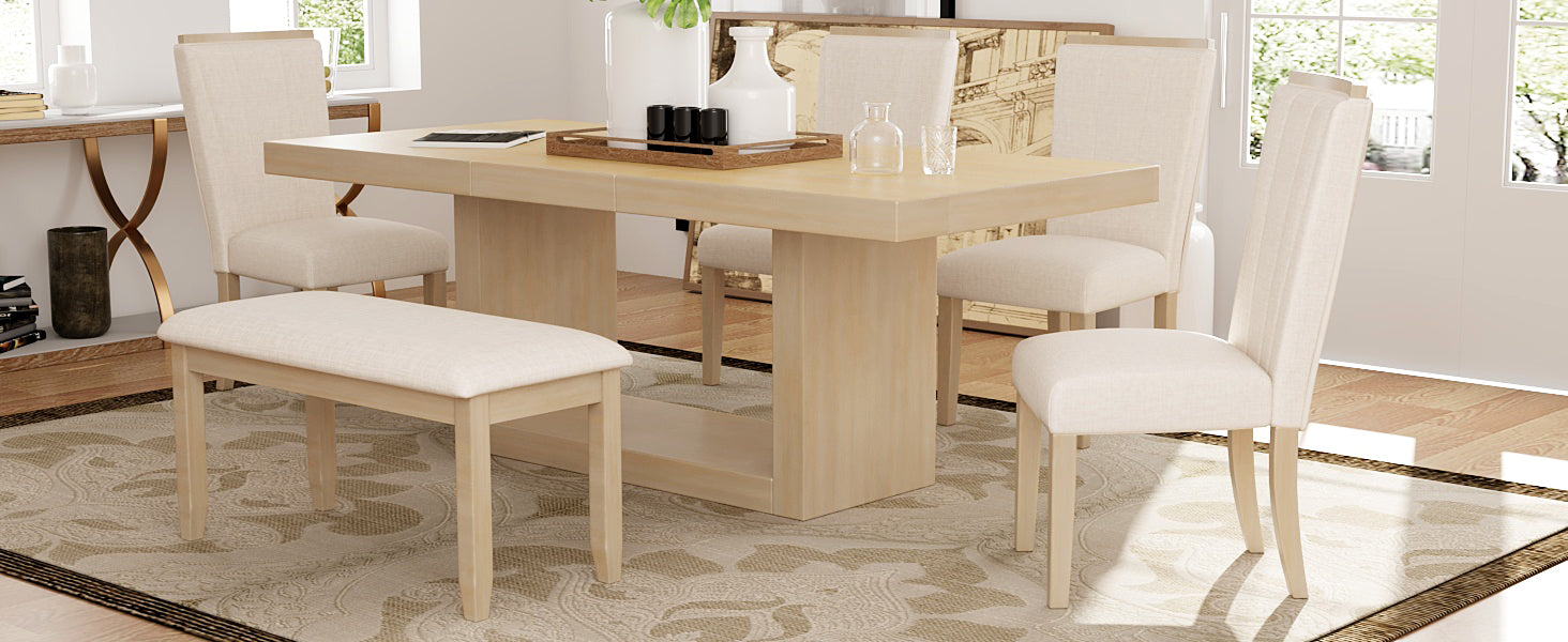 Light wood dining table with cream upholstered bench and chairs