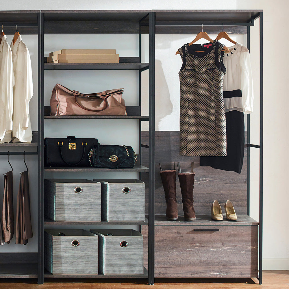 Beige duffel bag with leather handles in an open closet