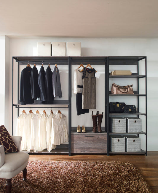 Black tailored blazer for men on a hanger in a closet