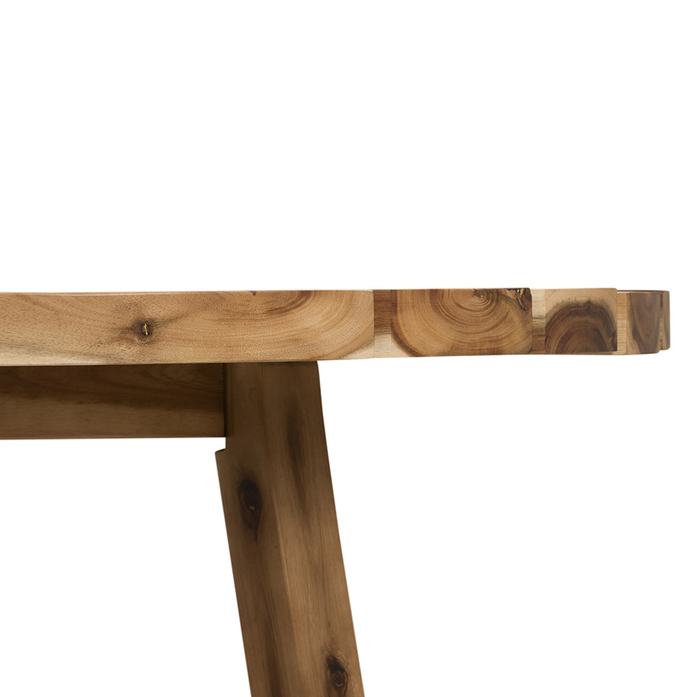 Live edge acacia wood dining table with unique circular grain patterns