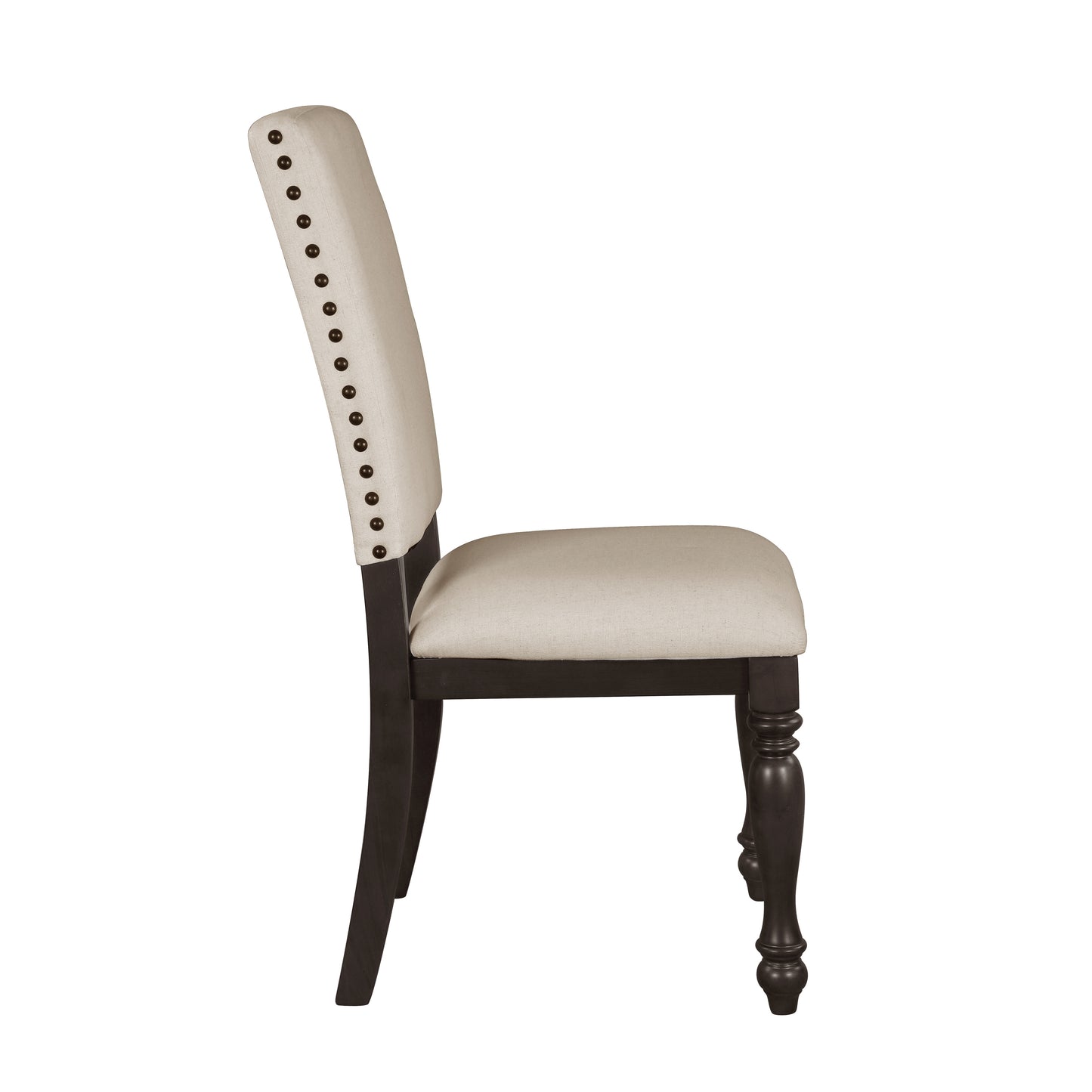 Side view of a cream upholstered dining chair with nailhead trim and dark wood legs