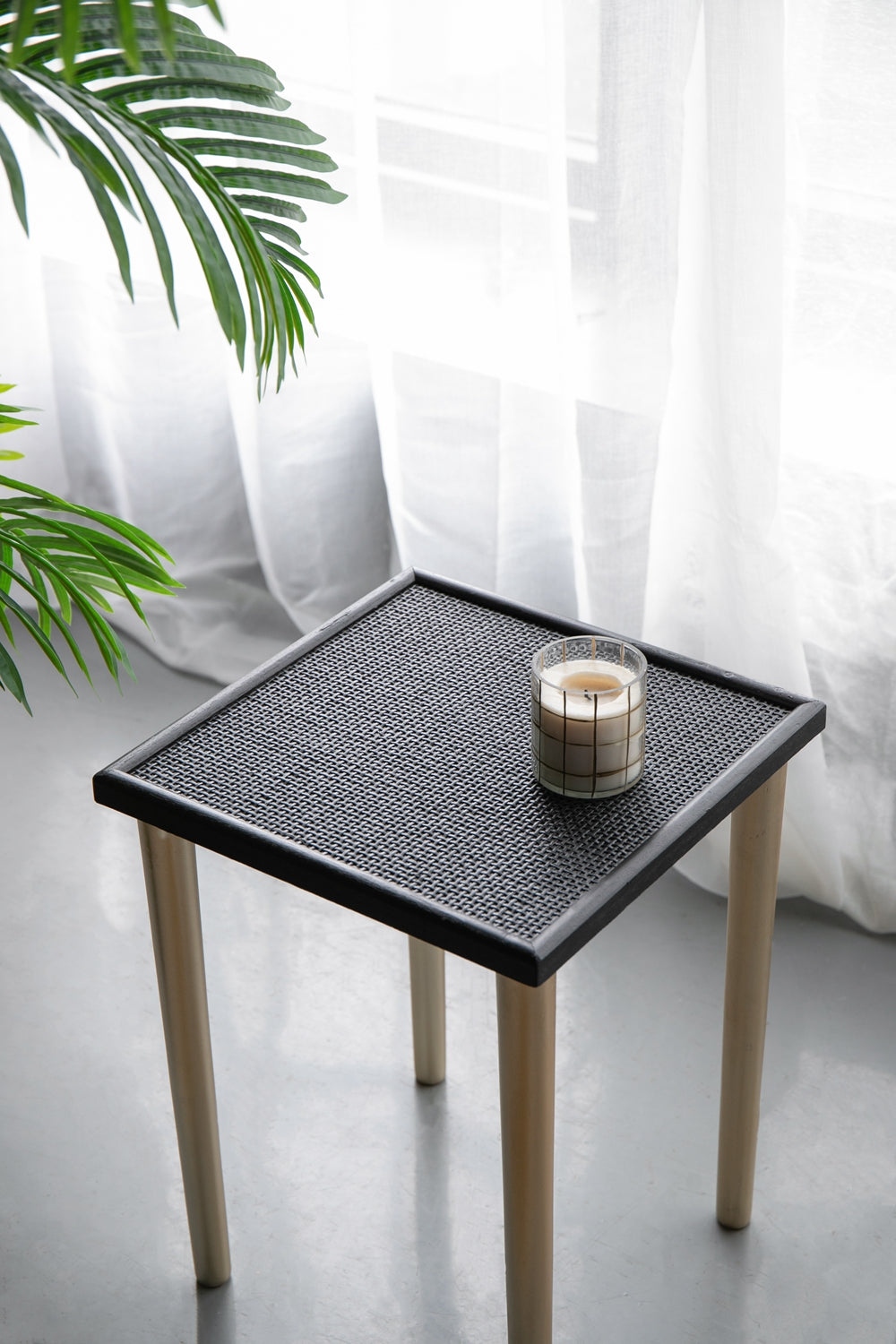 Square black rattan side table with natural wood legs stylish accent piece