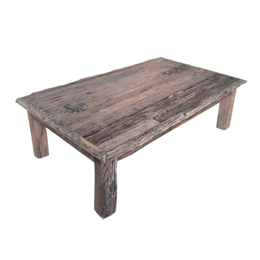 Rustic reclaimed wood coffee table with rough texture and natural finish