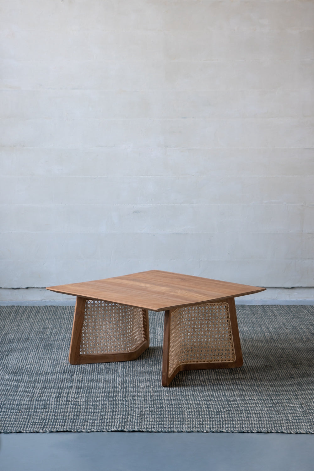 Midcentury modern wooden coffee table with woven cane accents