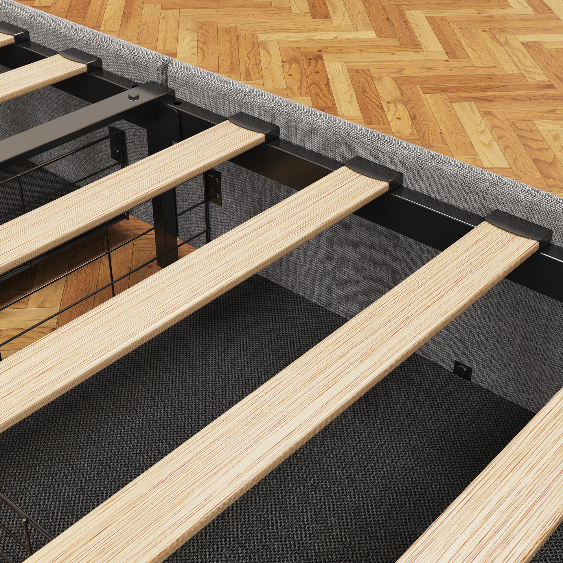 Close up of a grey upholstered bed frame with wooden slats