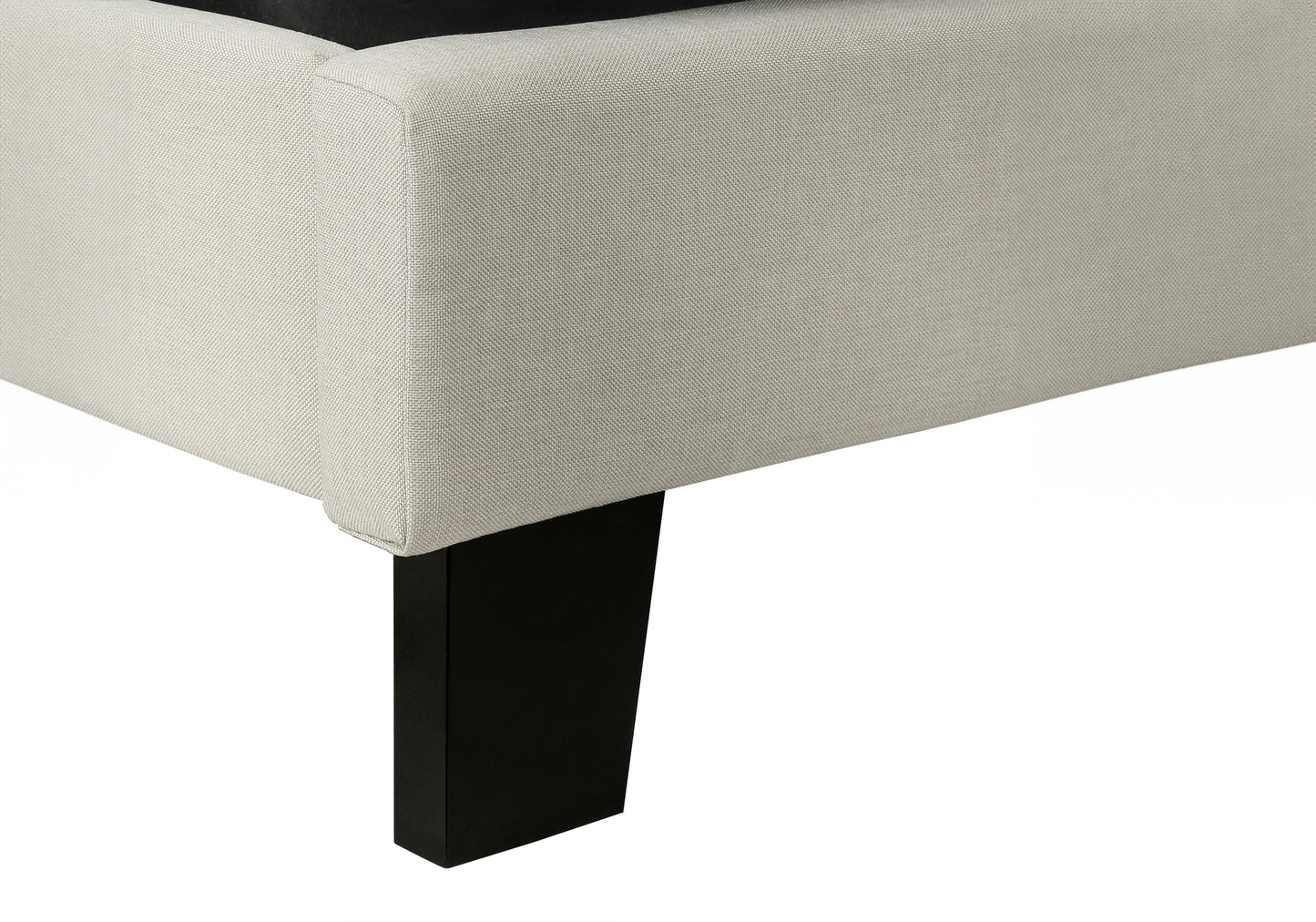 Upholstered bed frame in beige linen fabric with a single dark wood leg