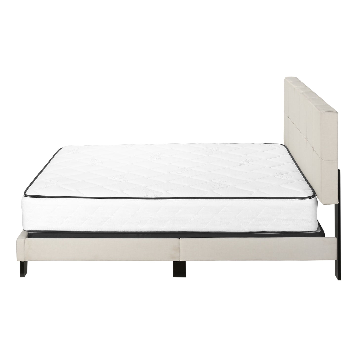 Queen size mattress with quilted top and black piping on a beige upholstered bed frame with a buttontufted headboard