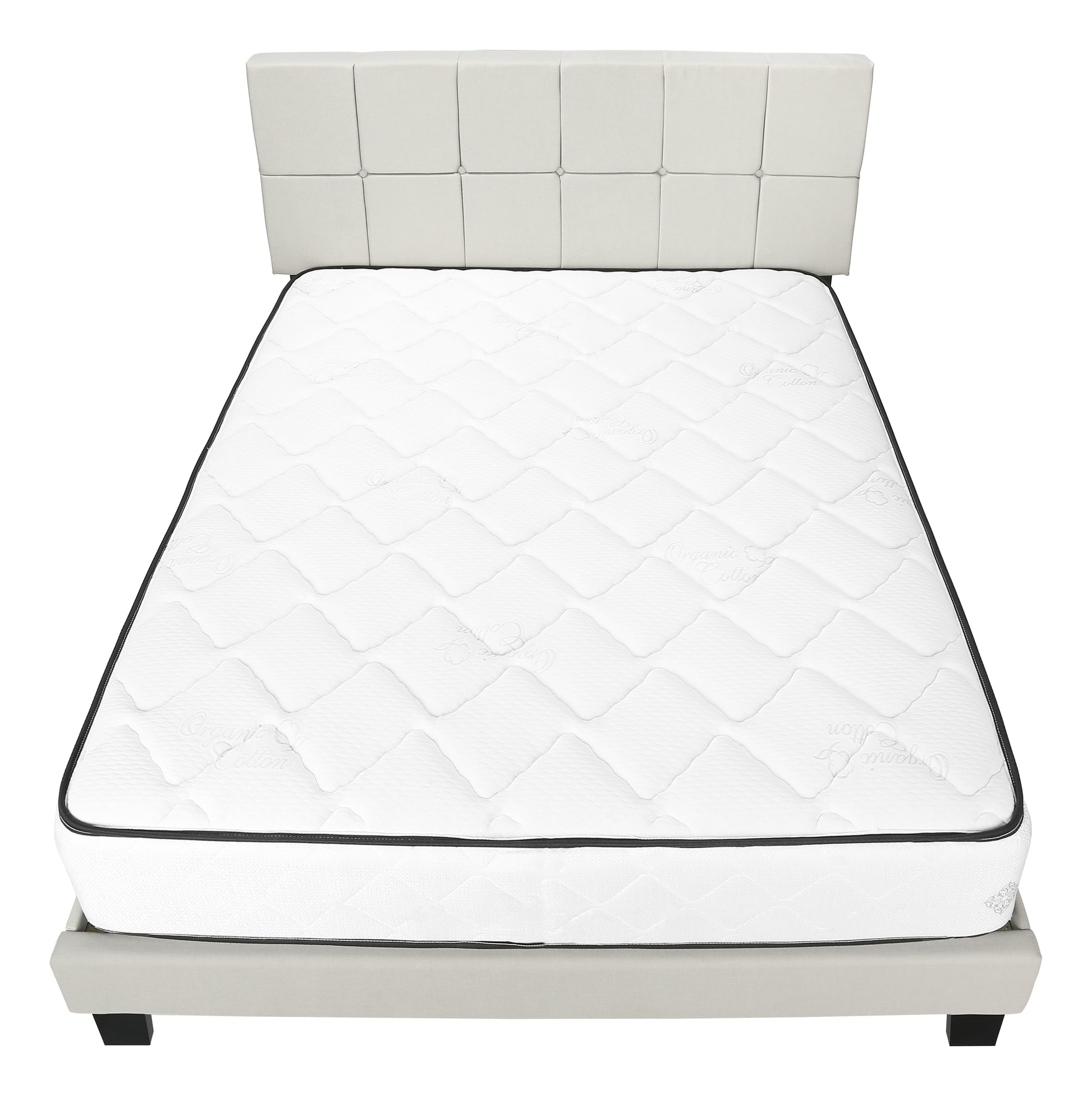 White queen size mattress on a light grey upholstered bed frame with a tufted headboard