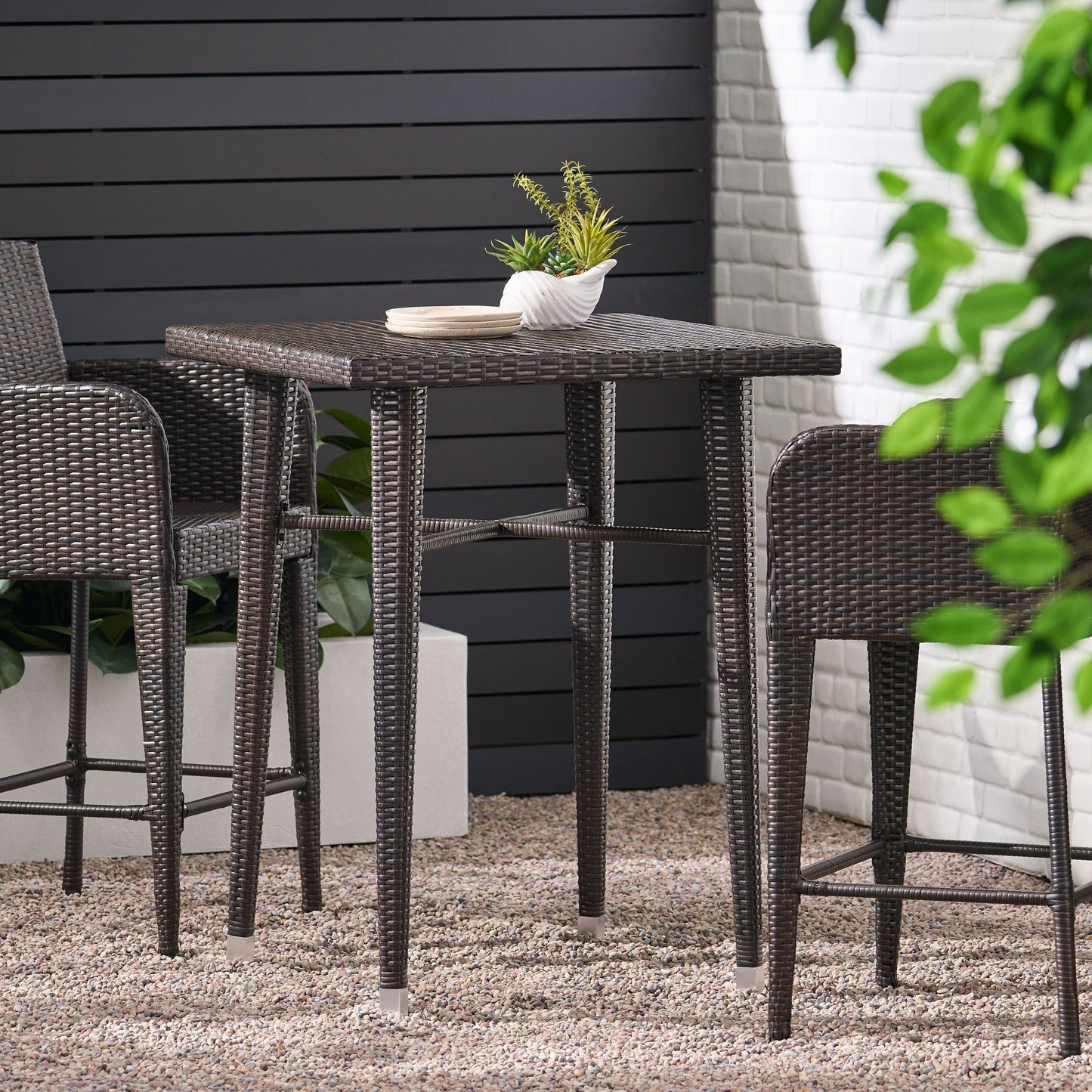 Dark brown wicker bar table set with modern design for outdoor patios