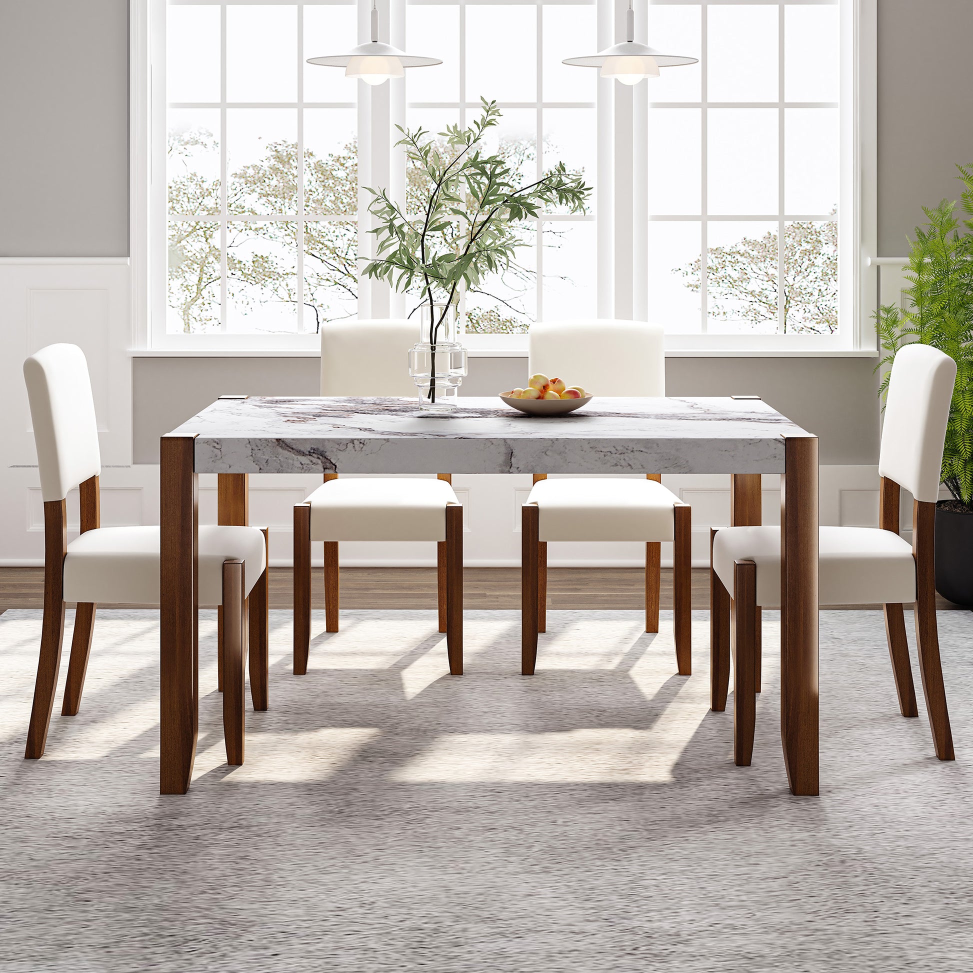 Modern marble dining table with walnut legs and upholstered cream chairs
