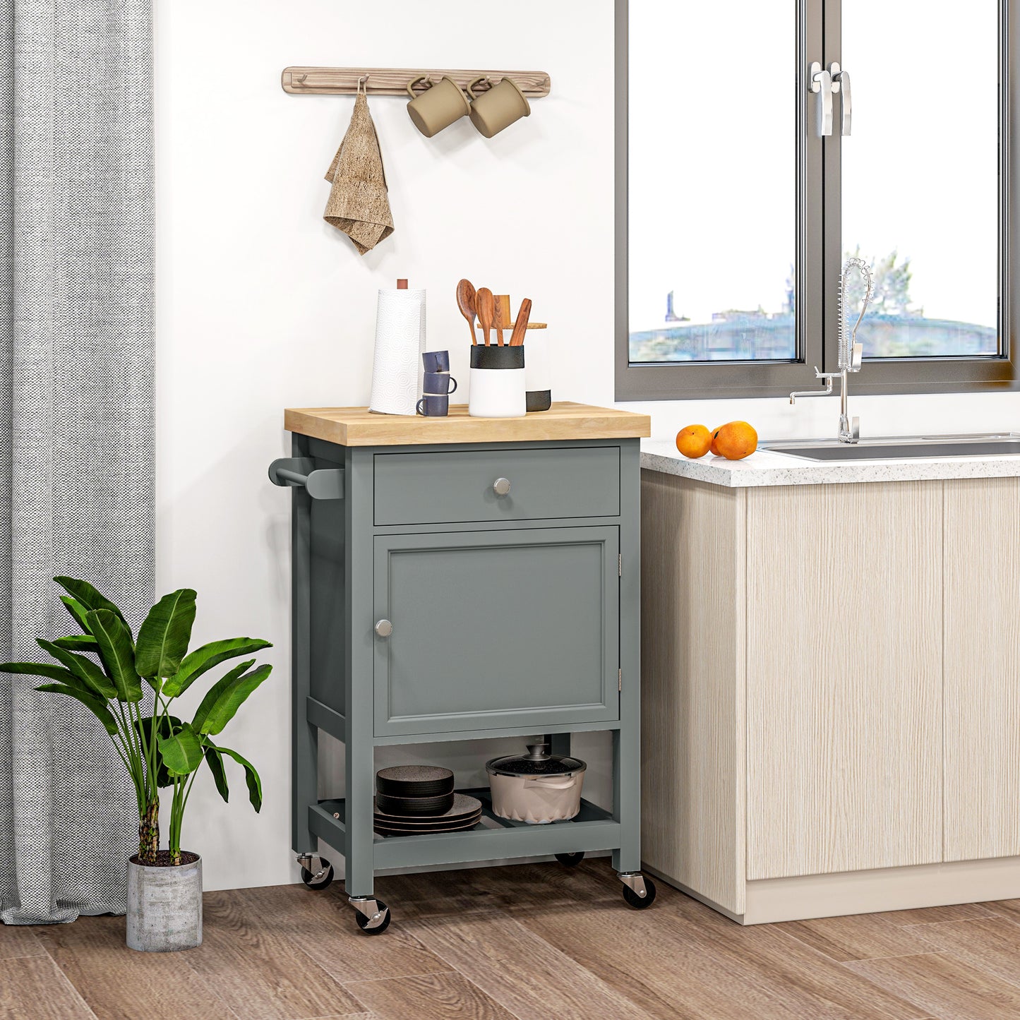 Grey kitchen cart with butcher block top and stainless steel hardware