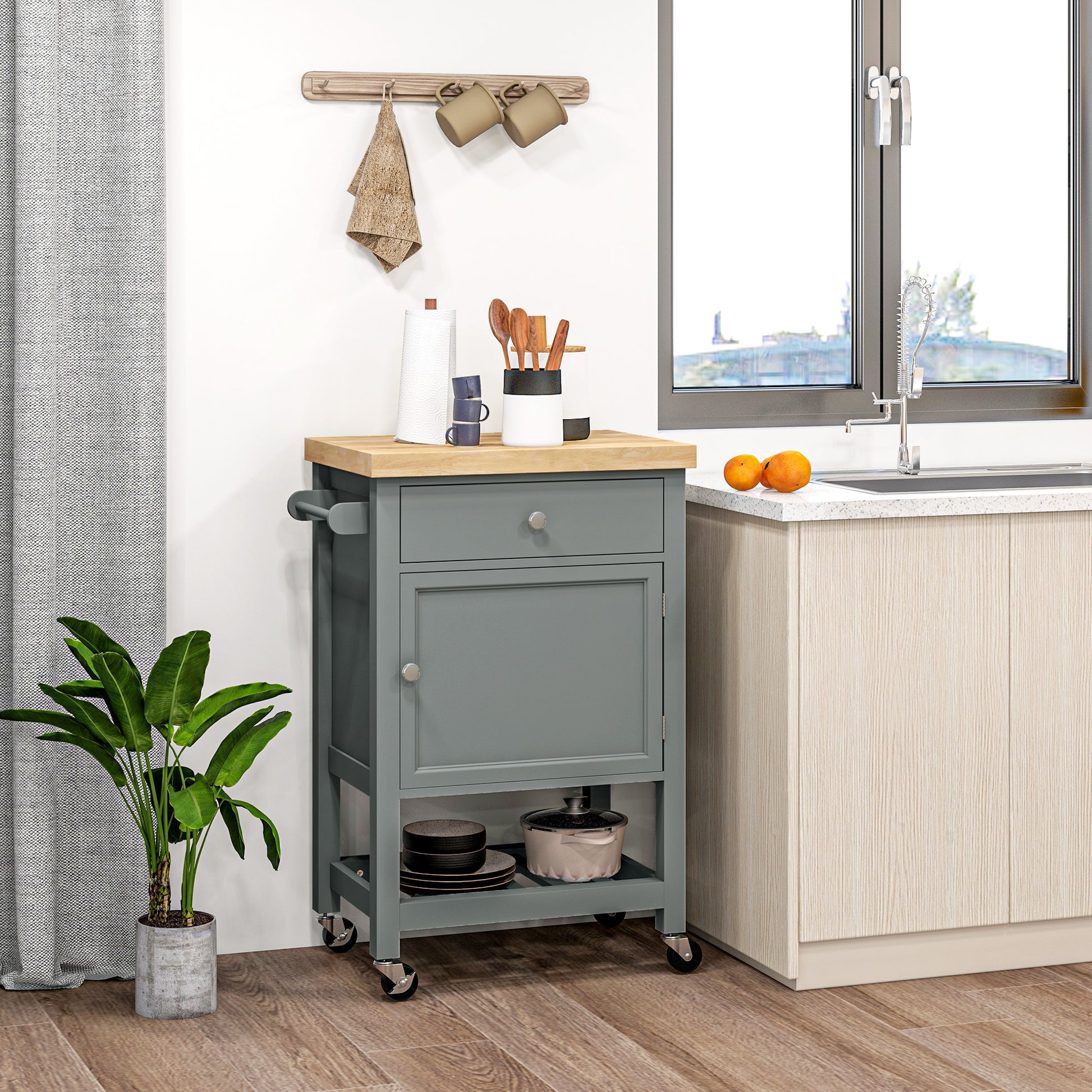 Grey kitchen cart with butcher block top and stainless steel hardware