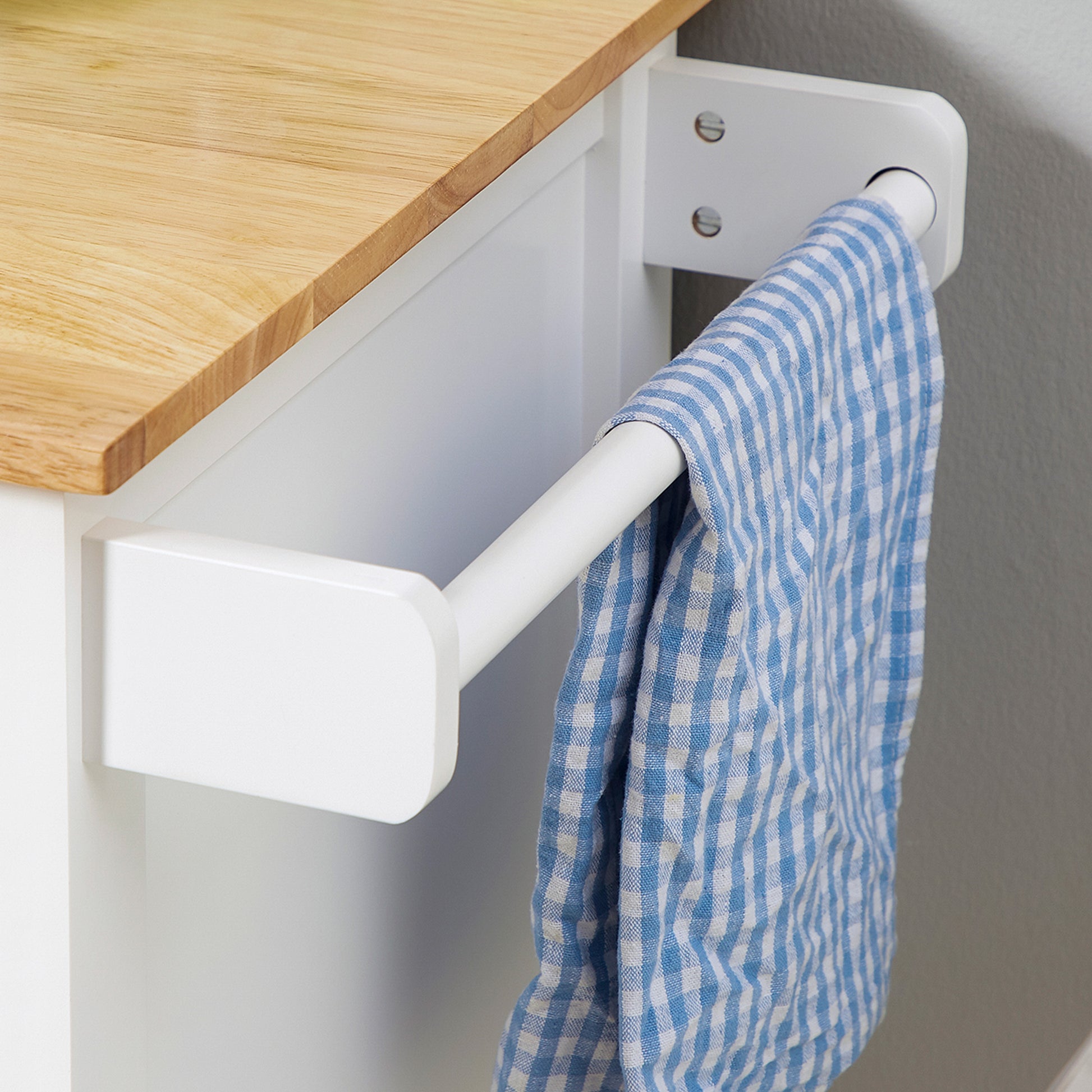 White kitchen cart with natural wood top and blue gingham towel