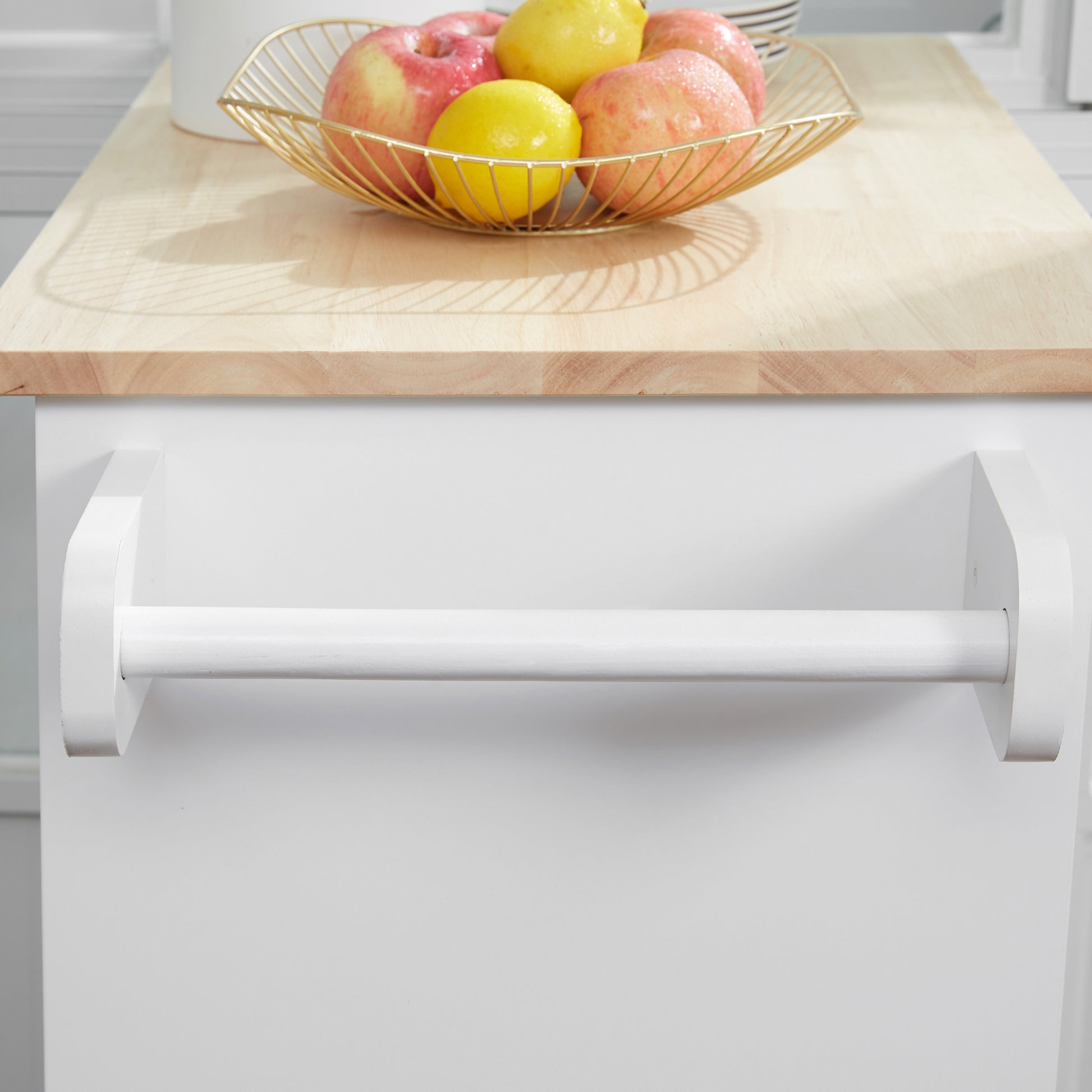 White wooden paper towel holder mounted under a light wood countertop