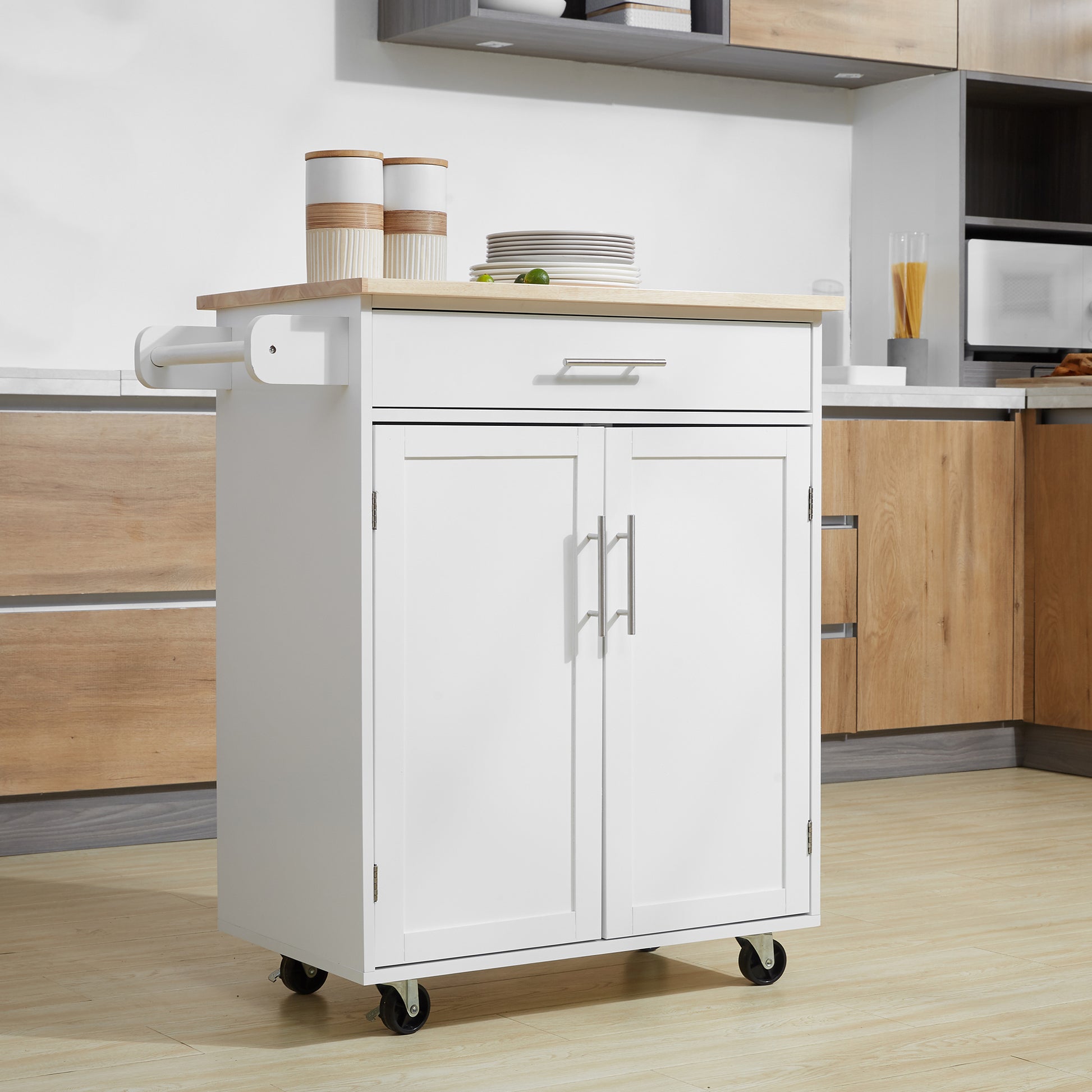 White kitchen island with wooden top and chrome handles