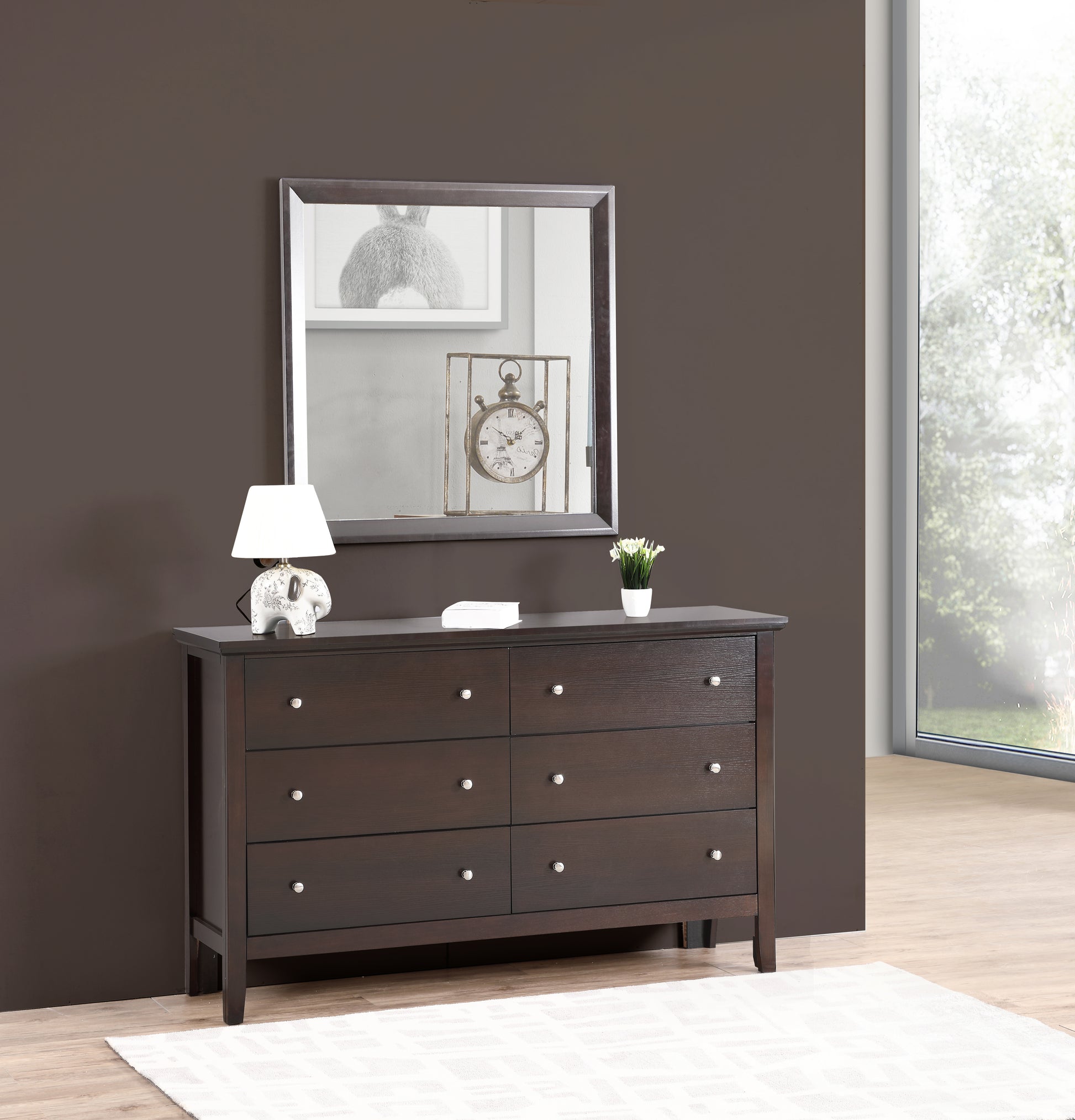 Dark wood sixdrawer dresser with silver pulls and a rectangular mirror above