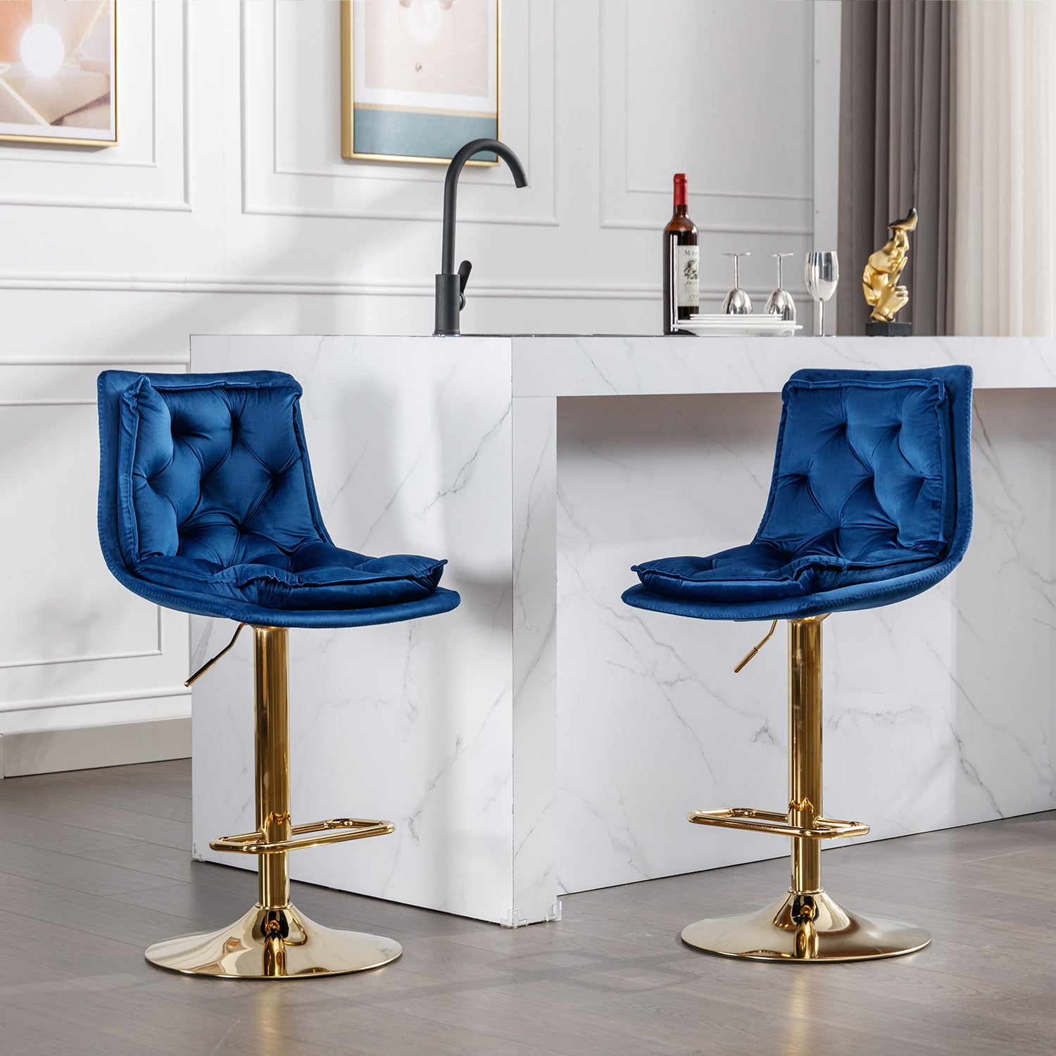 Blue velvet bar stool with tufted back and gold pedestal base