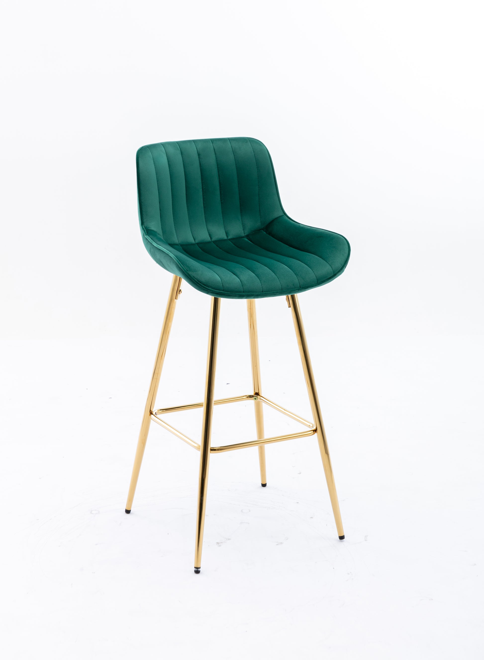 Green velvet bar stool with plush vertical tufting and gold metal legs