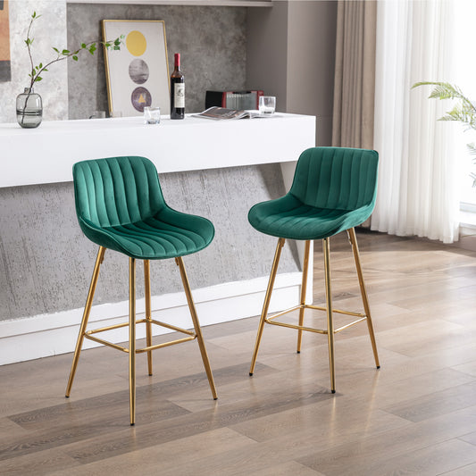 Emerald green velvet bar stool with gold legs and channel tufting