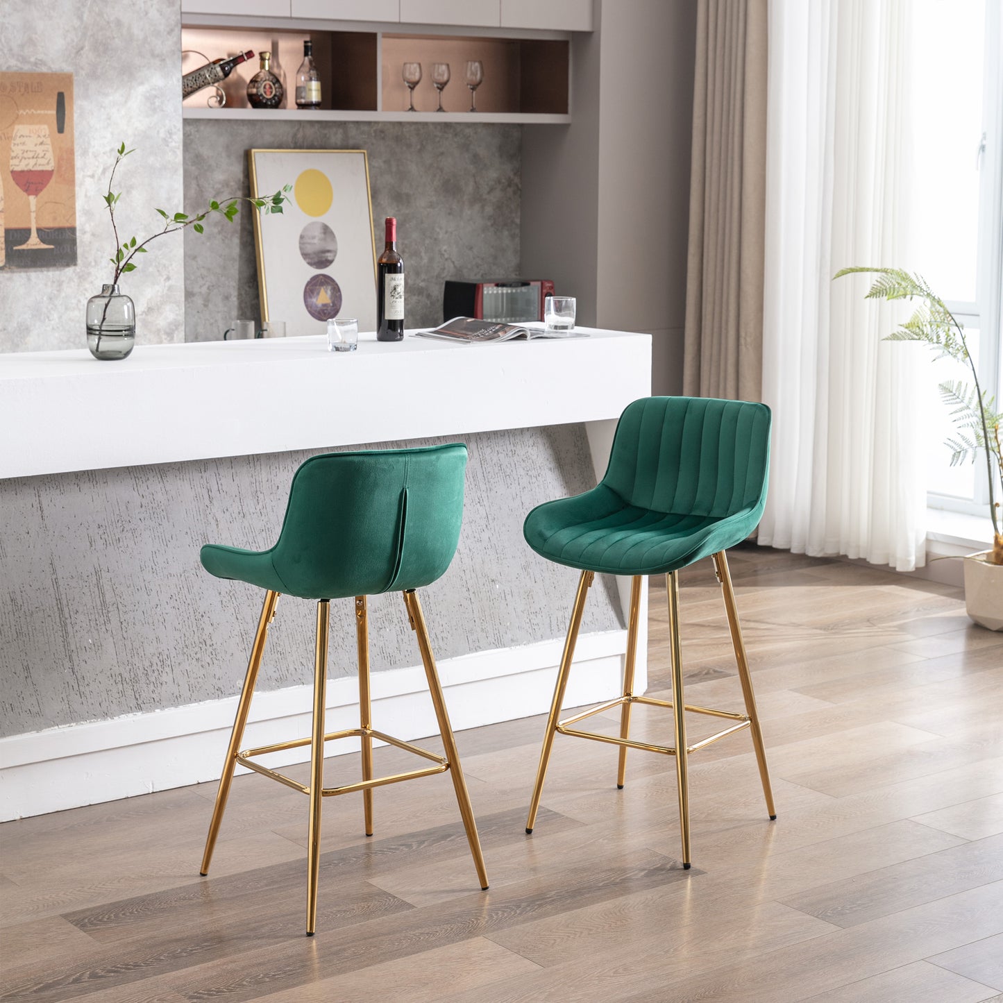 Emerald green velvet bar stool with gold legs and plush cushioning