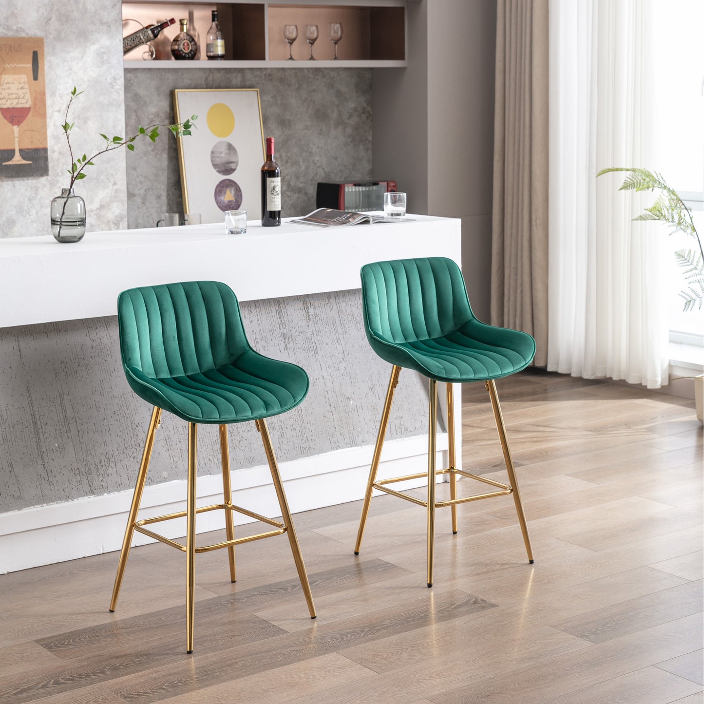 Emerald green velvet bar stool with gold legs and fluted design