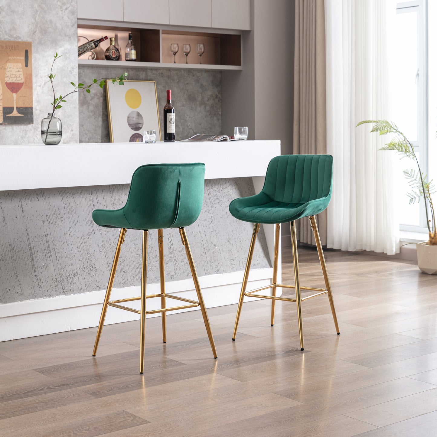 Emerald green velvet bar stool with plush tufted seat and gold legs