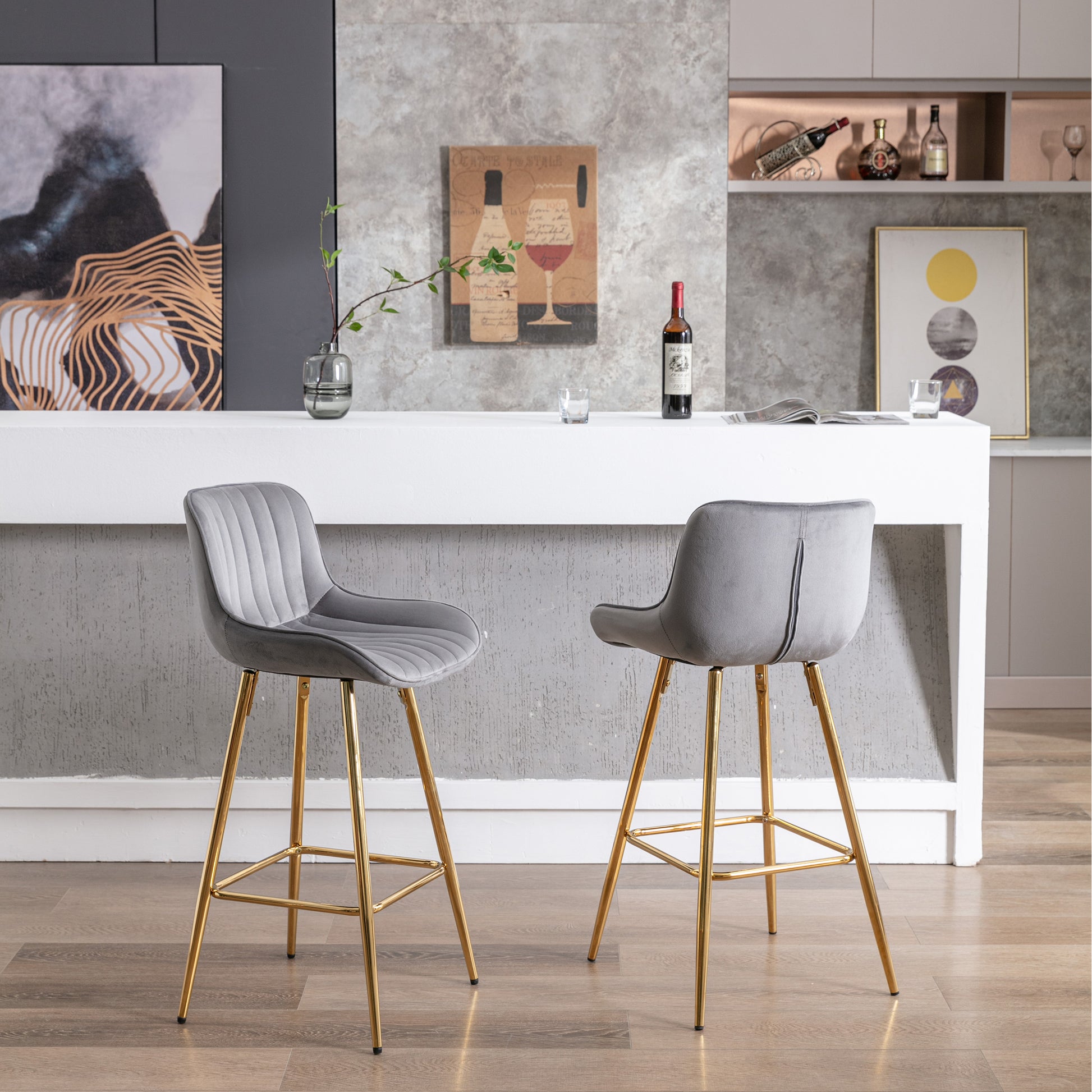 Gray velvet bar stool with plush channel tufting and gold metal legs