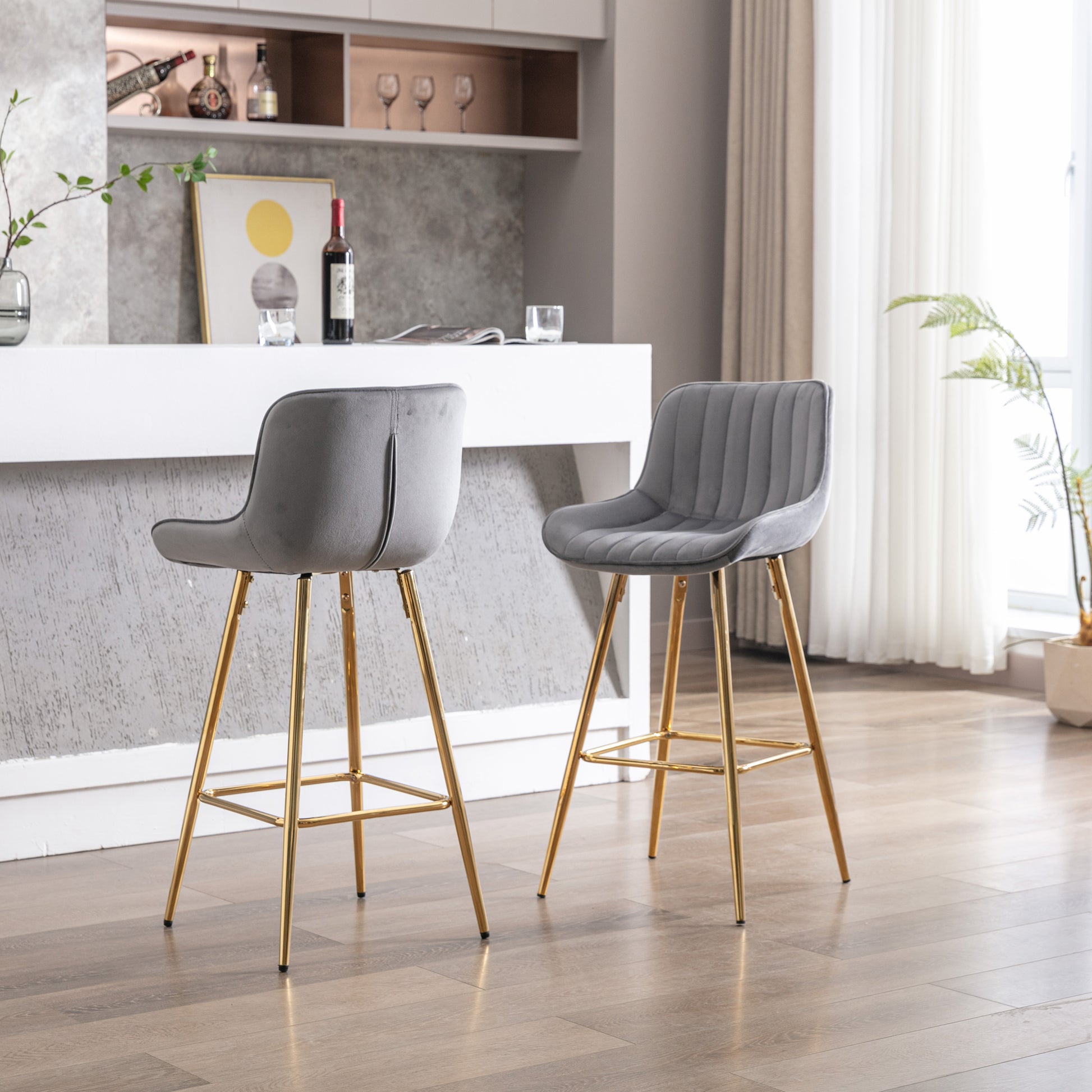 Grey velvet counter stool with channel tufting and gold legs