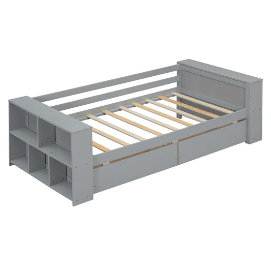 Grey toddler bed with builtin storage shelves and drawers