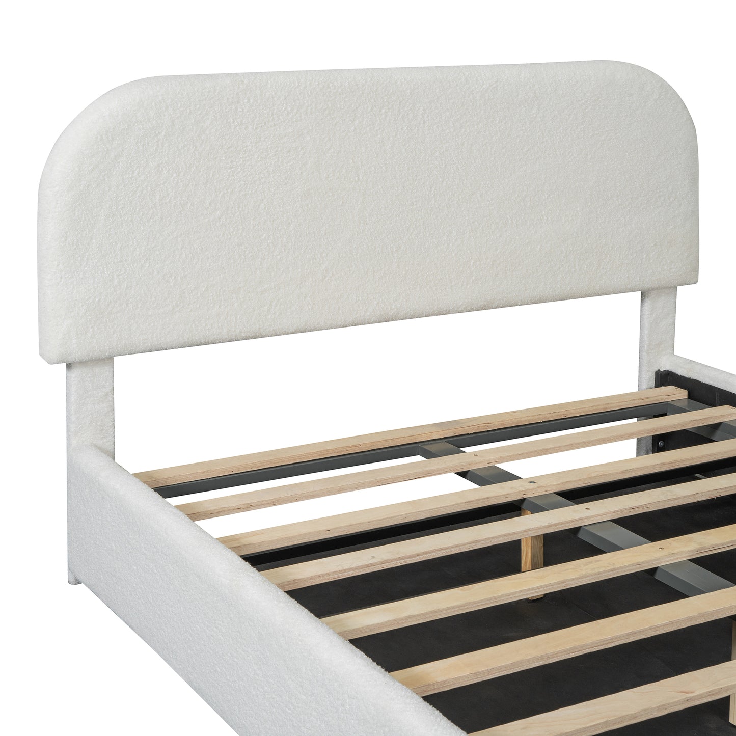 Closeup of a white teddy fabric upholstered bed frame with a curved headboard and wooden slats