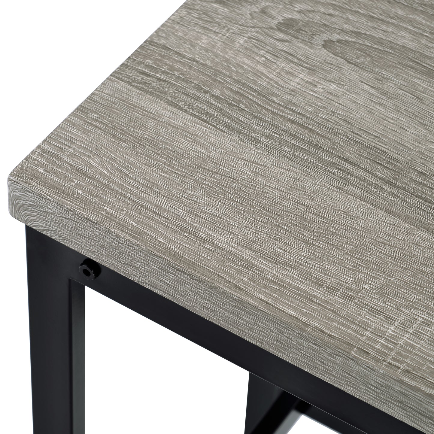 Closeup of distressed gray wood grain tabletop with black metal frame accent