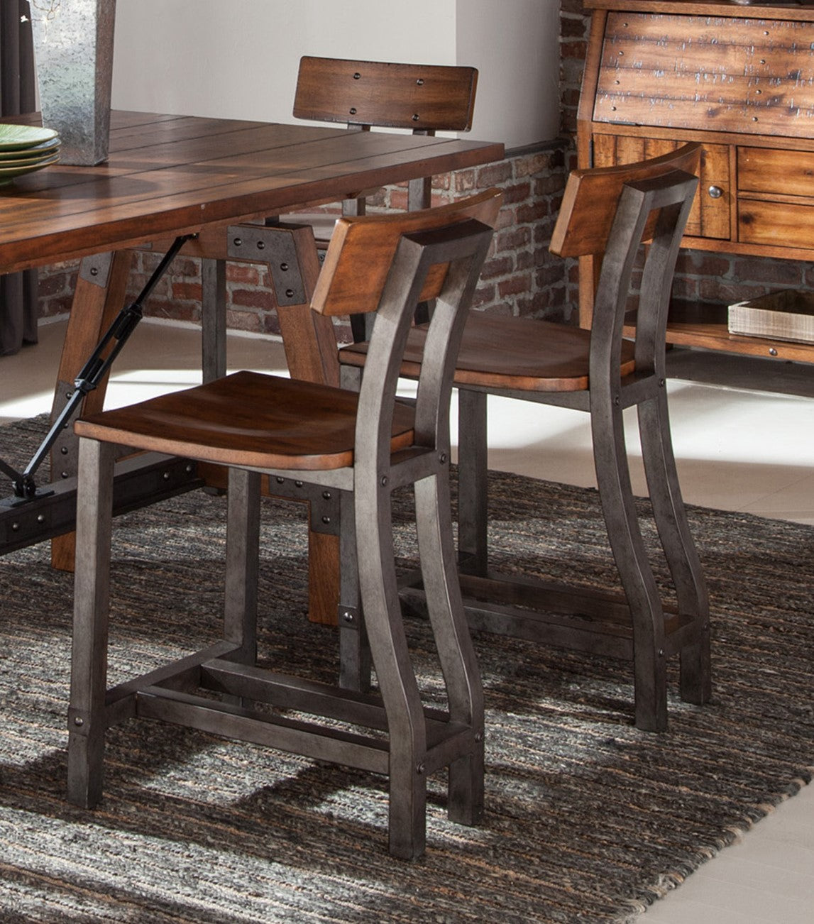 Rustic industrial counter stool with distressed metal frame and wood seat