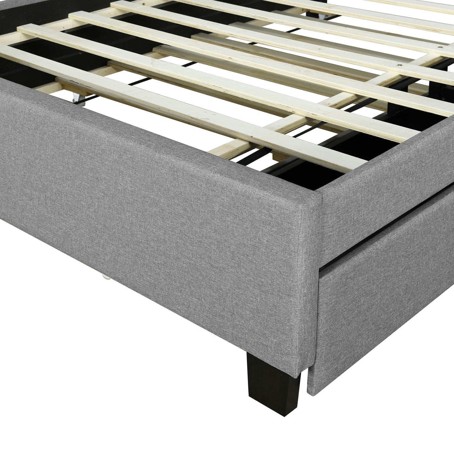 Gray upholstered bed frame detail with wooden slat support