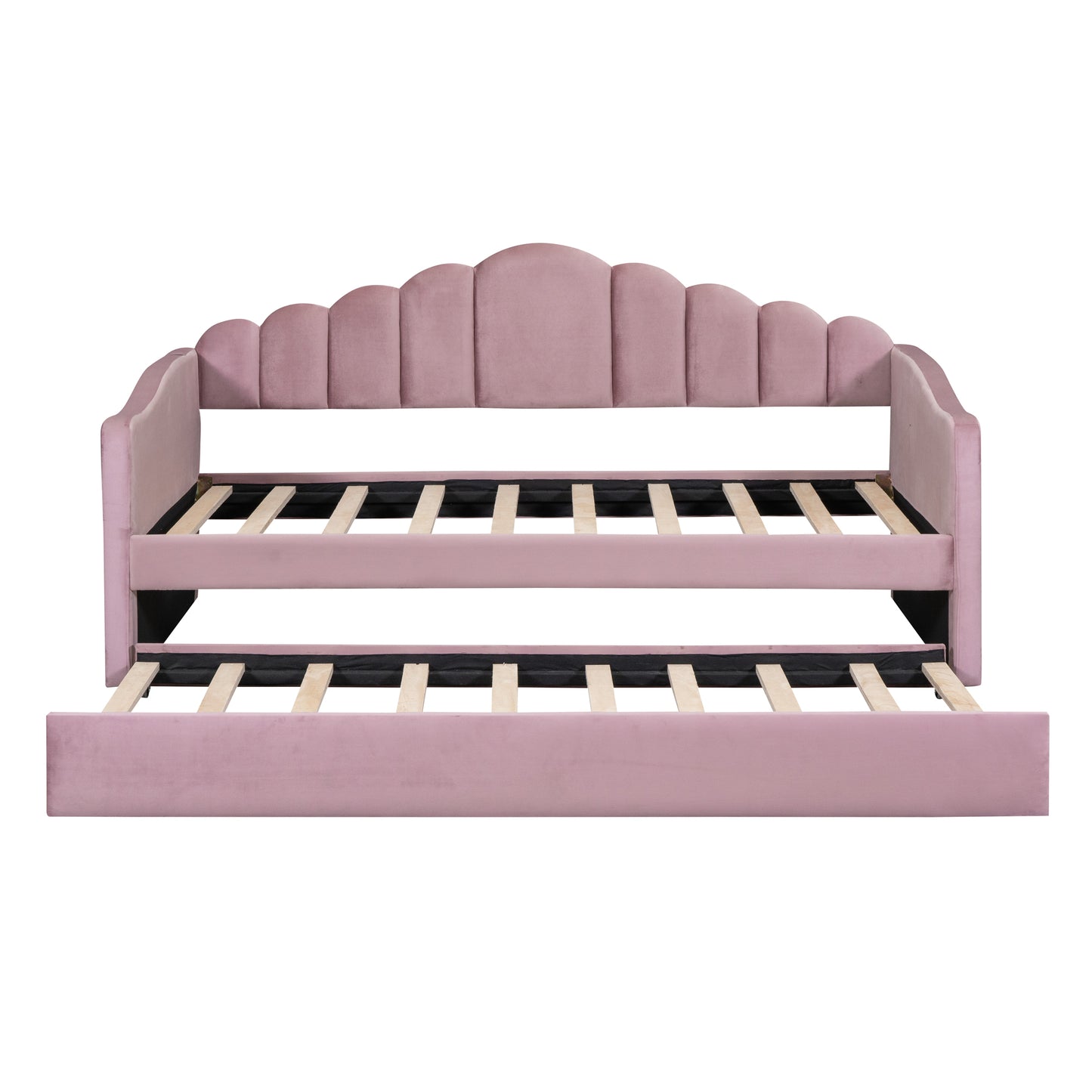 Pink velvet daybed with scalloped headboard and pullout trundle