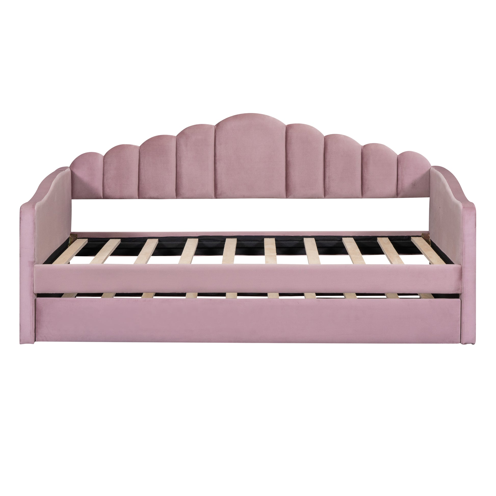 Pink velvet daybed with scalloped headboard and slat support