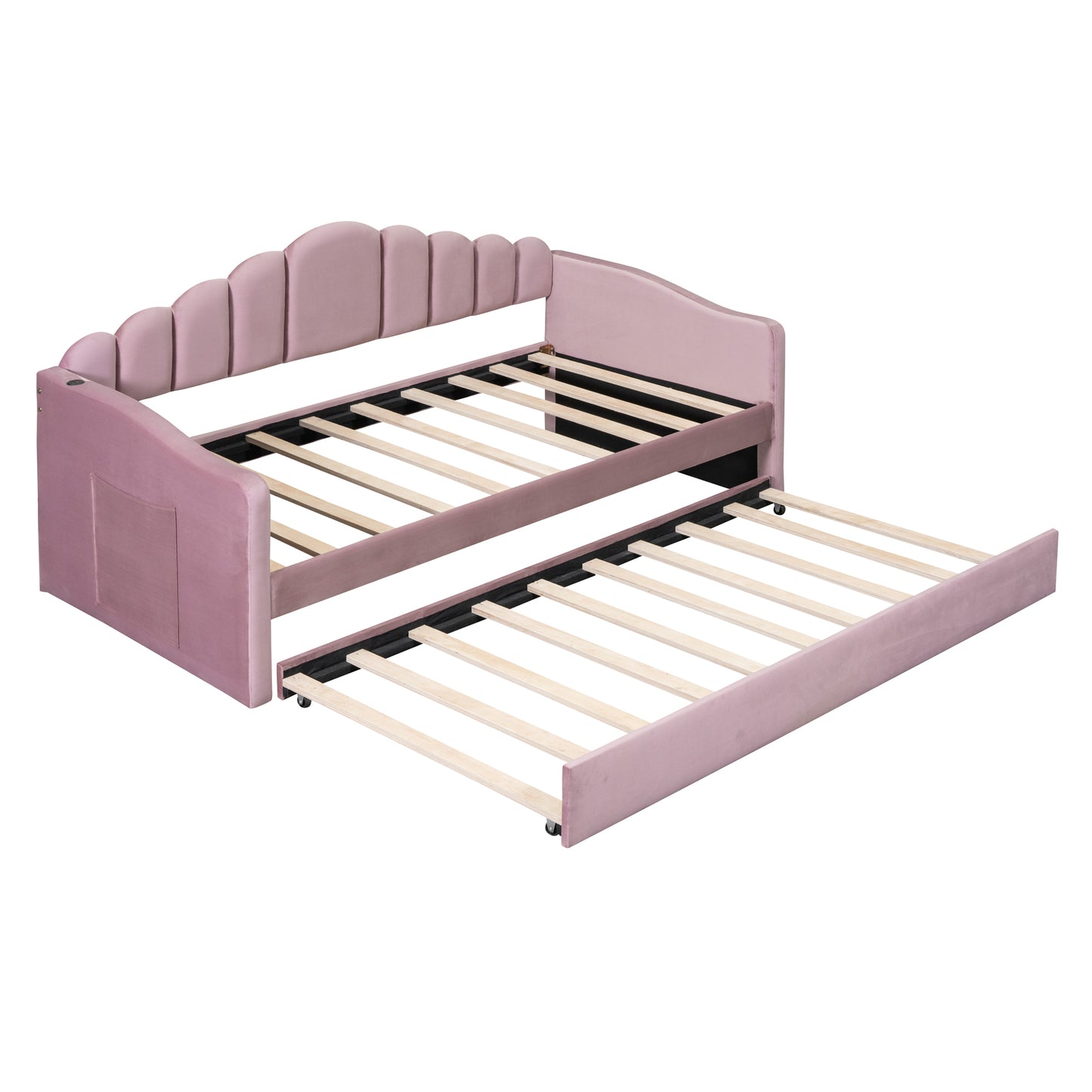 Pink velvet daybed with scalloped headboard and pullout trundle for kids