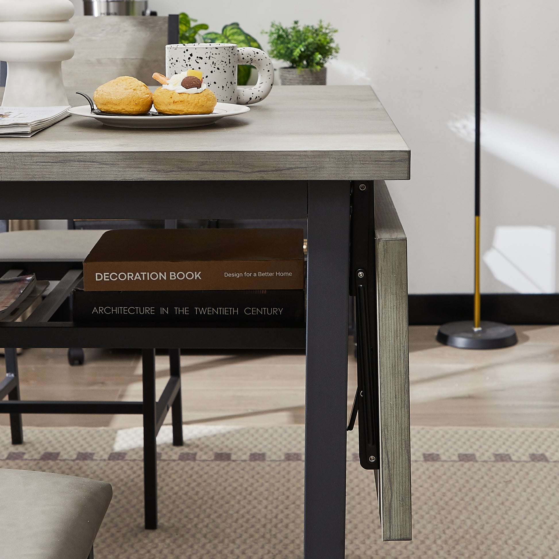 Gray wood grain dining table with black metal legs perfect for small spaces